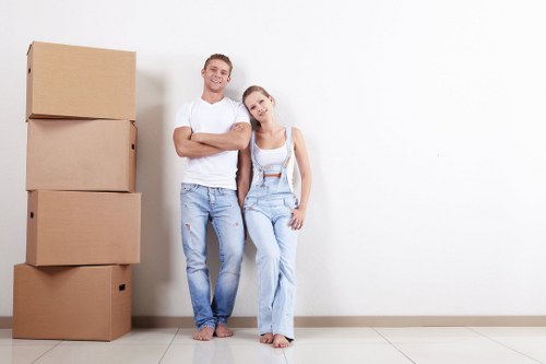 Furniture pick-up service removing a sofa in Richmond