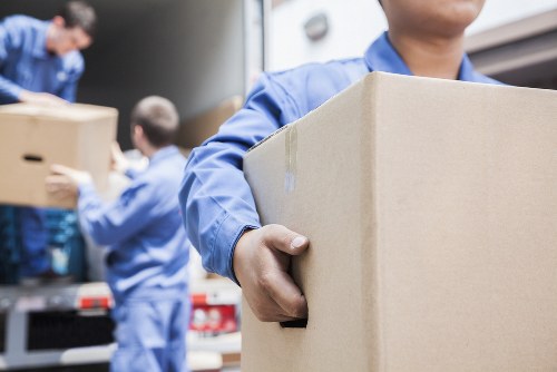 Man and van team loading furniture for a removal service