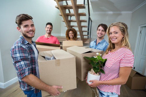 Students packing boxes for removals in Richmond