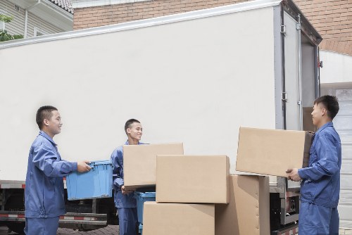 Moving staff using proper lifting technique on a household item